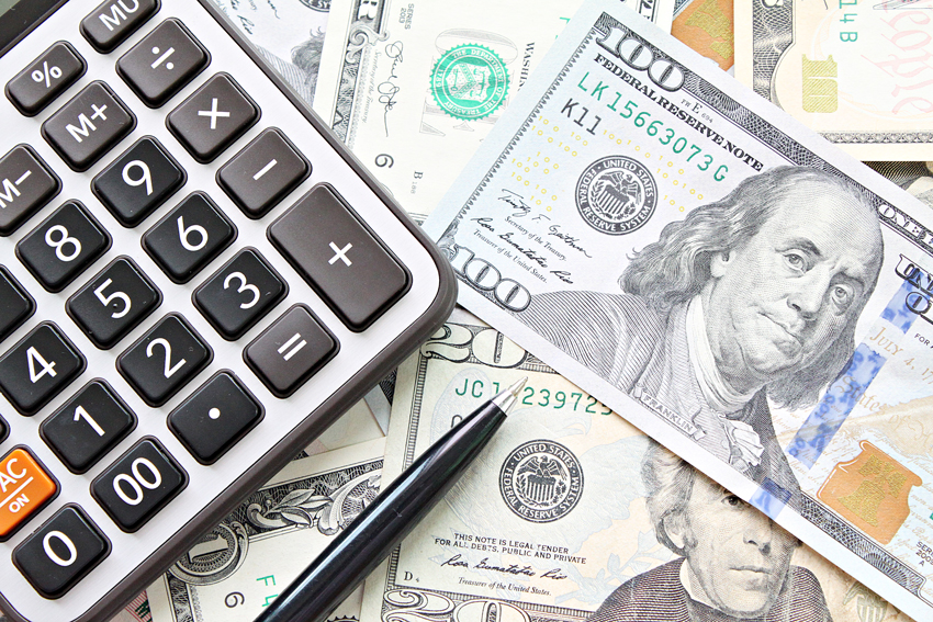 A calculator sitting on money